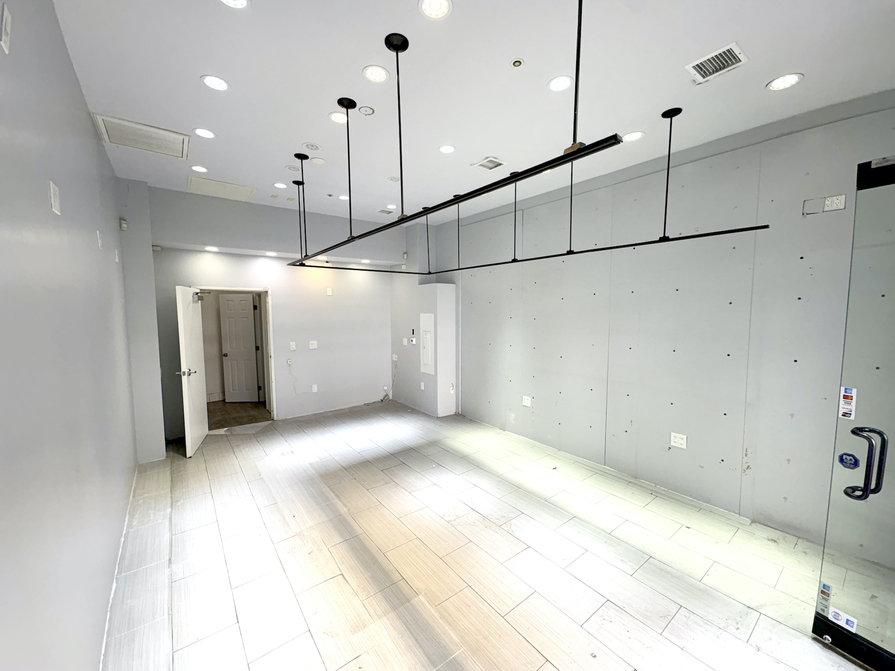 Open retail layout and wood-tile flooring at 758 S Broadway